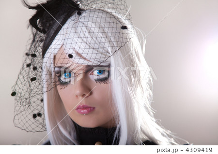 Portrait of young woman wearing blue contact lenses 4309419