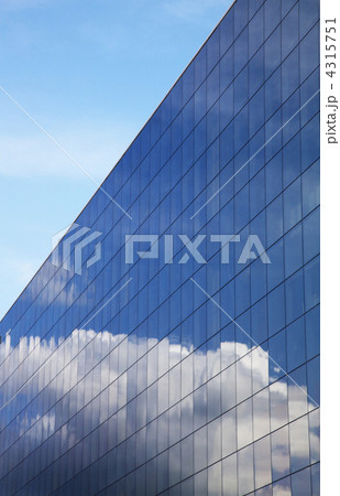 Modern office building and blue sky reflection 4315751