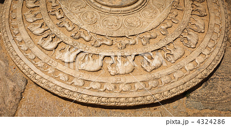 Ancient moonstone at the entrance of Buddhist dagoba Ancient moonstone at the entrance of Buddhist dagoba 4324286