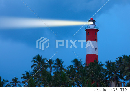 Lighthouse in night with light beam Lighthouse in night with light beam 4324559