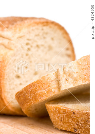 Sliced bread on wooden plate 4324959