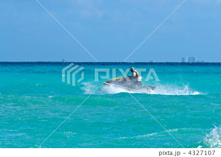 Man riding jet ski Man riding jet ski 4327107