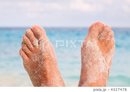 Mans Feet on the beach 4327478
