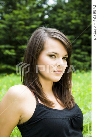 Pretty girl laying on the meadow 4329942
