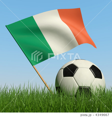 Soccer ball in the grass and flag of Ireland. Soccer ball in the grass and flag of Ireland. 4349667