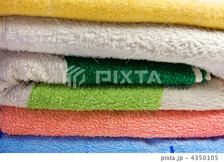 Stack offolded brightly color beach towels 4350105