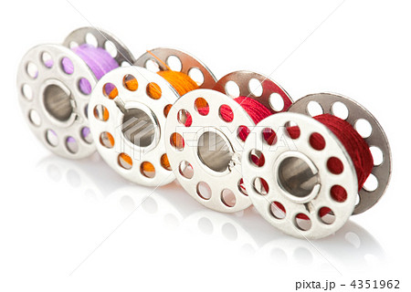 Colored bobbins for machine sewing isolated on white background 4351962