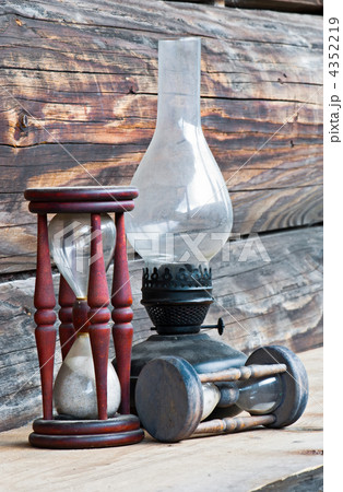 Vintage things. Old style oil lamp with a glass bulb and wooden 4352219