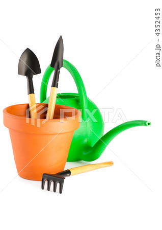 Terracotta frower pot, watering can and garden tools on white ba Terracotta frower pot, watering can and garden tools on white ba 4352453