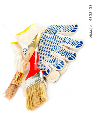 Painter working tools. Paintbrushes and gloves. 4352458