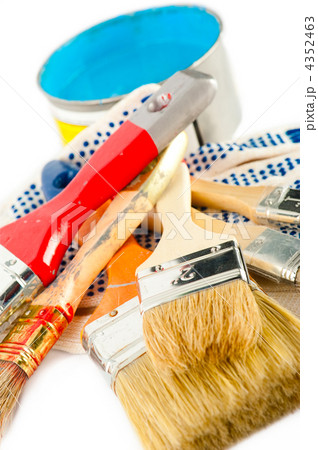 Painter working tools. Paint bucket with blue paint, gloves and Painter working tools. Paint bucket with blue paint, gloves and 4352463