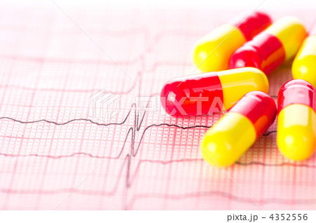 Cardiology. Macro of ECG graph and cardio pills. Shallow depth o 4352556