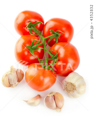 Food background: Fresh ripe tomatoes and garlic isolated on whit 4352832