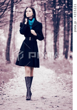Young woman walking in forest Young woman walking in forest 4355221