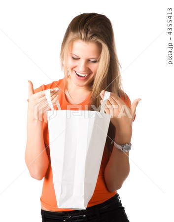 Young smiling woman looking into shopping bag 4355413
