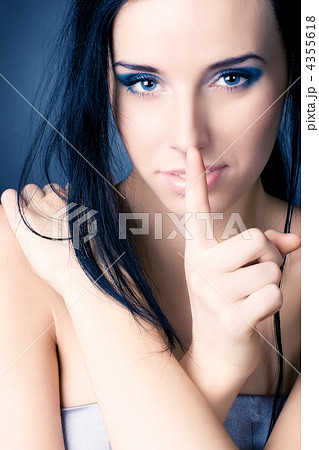 Young woman showing quiet sign 4355618