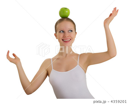 funny girl balancing on her head with an apple isolated 4359201