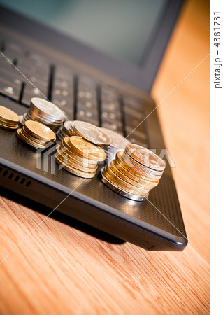 coins on the laptop 4381731