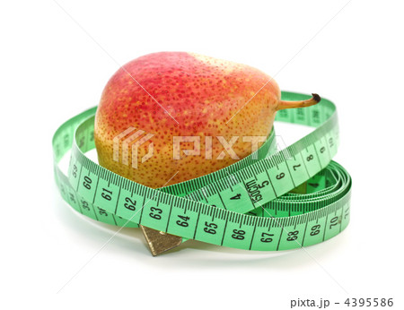 Ripe pear and measuring a meter on a white background Ripe pear and measuring a meter on a white background 4395586