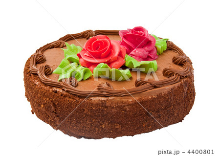 Chocolate cake with two cream-colored roses. Isolated on white background. Chocolate cake with two cream-colored roses. Isolated on white background. 4400801