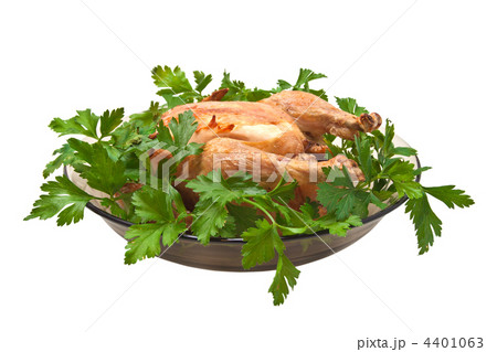 Grilled chicken on a platter with parsley. 4401063
