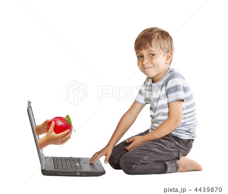 hand with an apple and through the computer screen hand with an apple and through the computer screen 4439870