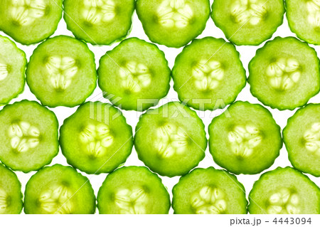 Slices of fresh Cucumber / background / back lit 4443094