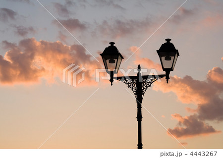 Silhouette of street lamp on sky background in sunset time 4443267