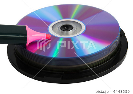Pink marker on pile of compact disks 4443539