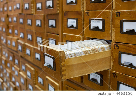 Old wooden card catalogue with one opened drawer Old wooden card catalogue with one opened drawer 4463156