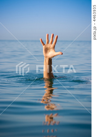 single hand of drowning man in sea asking for help 4463935