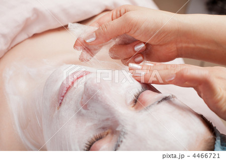 Silk mask applying, beauty treatment young woman face at salon Silk mask applying, beauty treatment young woman face at salon 4466721