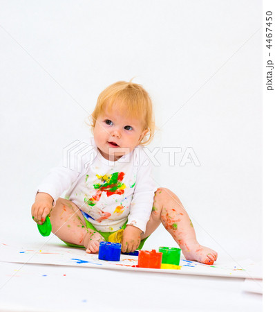 Baby girl drawing picture with paints 4467450