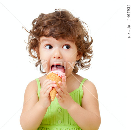 little curly girl with ice cream in studio isolated 4467934