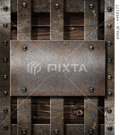 aged metal plate on wooden medieval background 4468177