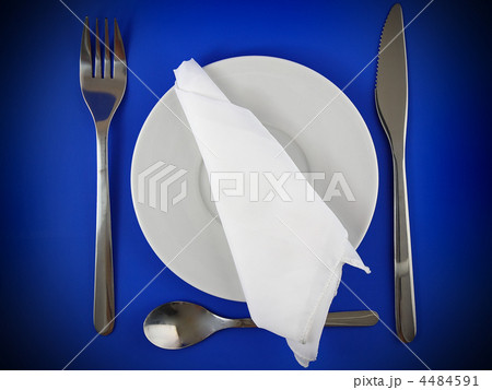 Table serving-knife,spoon,fork on blue backdrop. Table serving-knife,spoon,fork on blue backdrop. 4484591