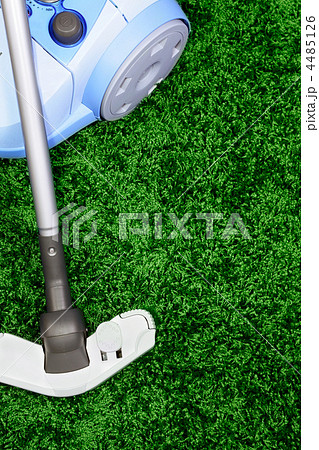 The metal pipe of vacuum cleaner in action -clean a carpet and floor The metal pipe of vacuum cleaner in action -clean a carpet and floor 4485126