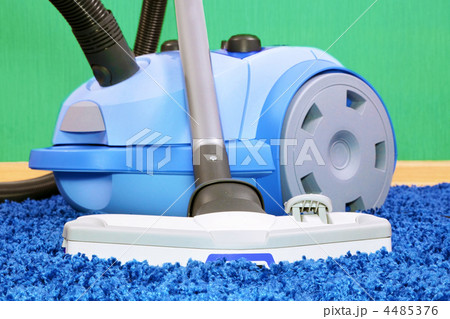 Vacuum cleaner stand  on blue carpet. 4485376