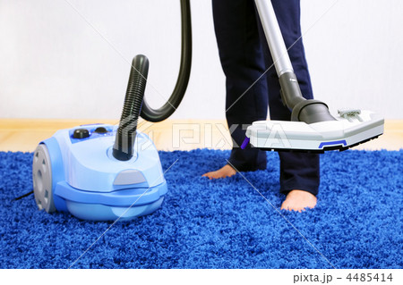 Vacuum cleaner in action-men cleaner a carpet. Vacuum cleaner in action-men cleaner a carpet. 4485414