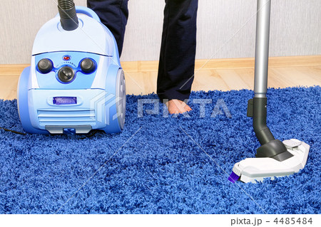 Vacuum cleaner in action-men cleaner a carpet. Vacuum cleaner in action-men cleaner a carpet. 4485484