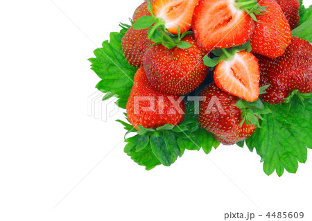 A heap of strawberries on green foliage. Isolated 4485609
