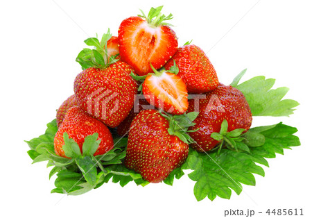 A heap of strawberries on green foliage. Isolated 4485611