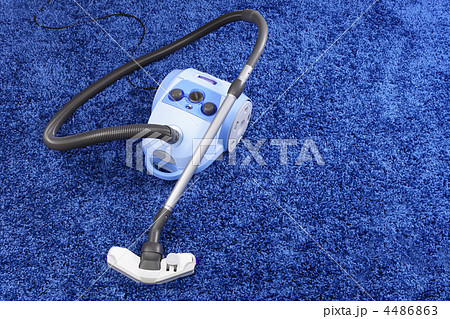 Vacuum cleaner stand  on blue carpet. 4486863