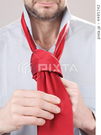 Man adjusting tie Man adjusting tie 4495742