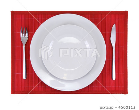 Table serving-dishware on red backdrop. 4500113
