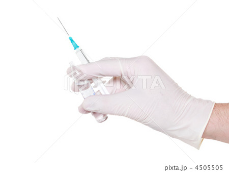 Syringe in hand in medical gloves, , injection. Syringe in hand in medical gloves, , injection. 4505505