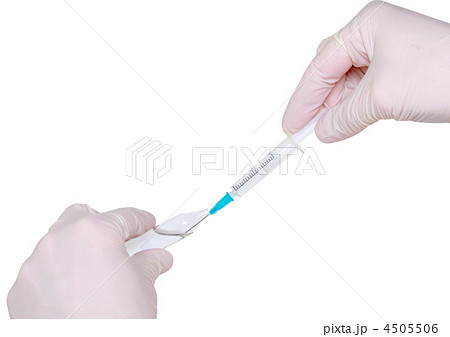 Syringe in hand in medical gloves, , injection. 4505506