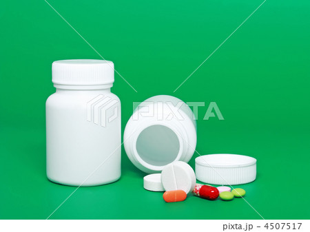 Medicine bottles, pills on colour background. 4507517