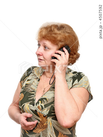 Senior lady speaks by a mobile phone. Senior lady speaks by a mobile phone. 4507592