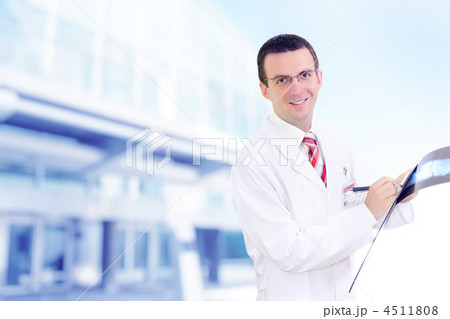 Doctor stand near the Hospital main Entrance. 4511808
